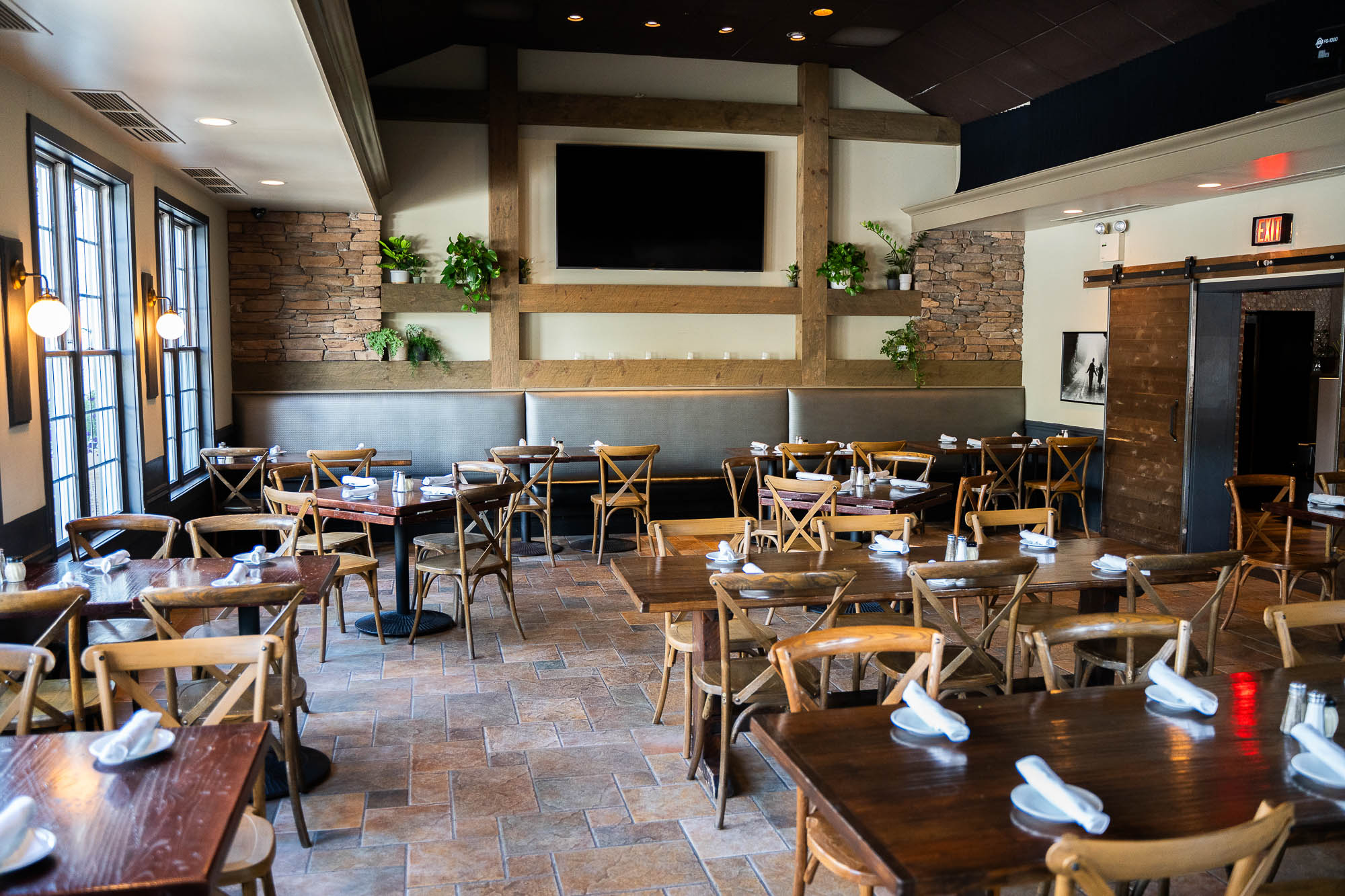 Interior, seating area, tables set with dining plates