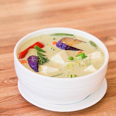 Green Curry with tofu, peppers, zucchinis, eggplants, green beans, peas, carrots, and basil.