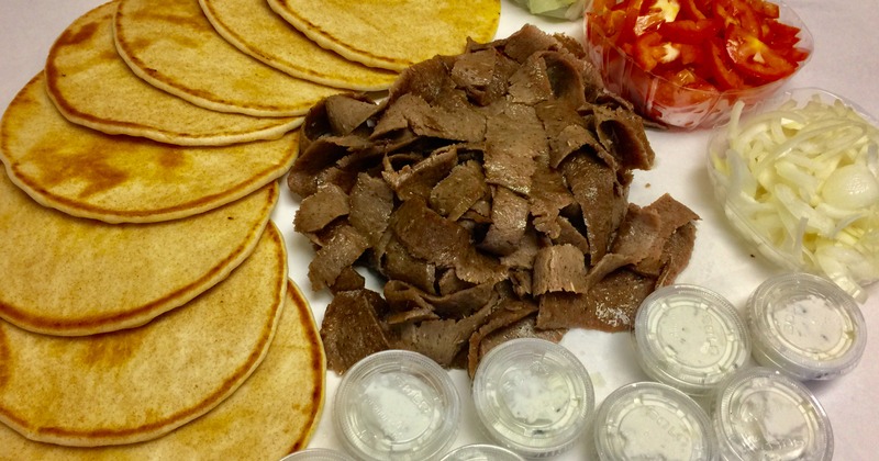 Gyro meat, pita wraps, tomato, onion, and tzatziki