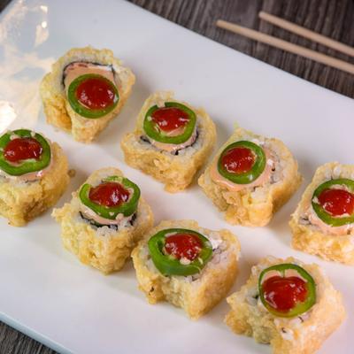 Vegas roll with salmon, avocado, cream cheese and jalapeno.
