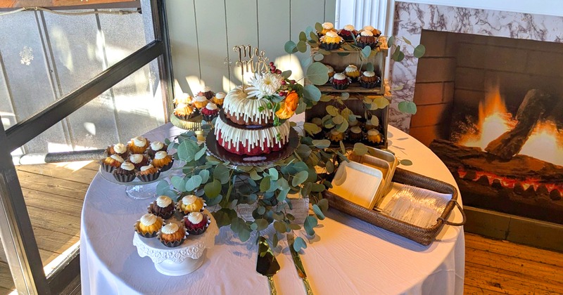 Circular table with cake displayed for event
