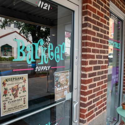 Front entrance, window sign.