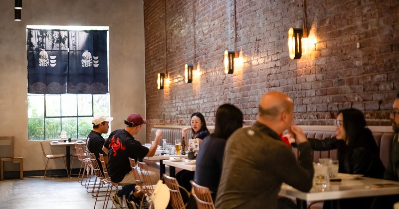 Cozy interior dining area with guests enjoying their food and drinks