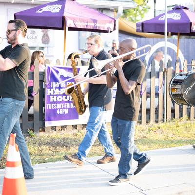 Brass band entering the restaurant's patio.