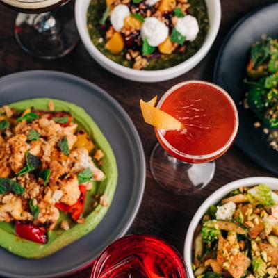 Multiple dishes and a cocktail.