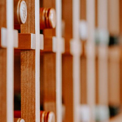 Wooden shelves for bottles.