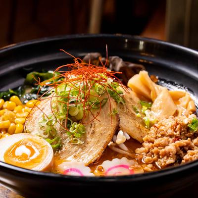 Spicy pork broth with miso, bean sprouts, corn, egg, bamboo sprouts and scallion.