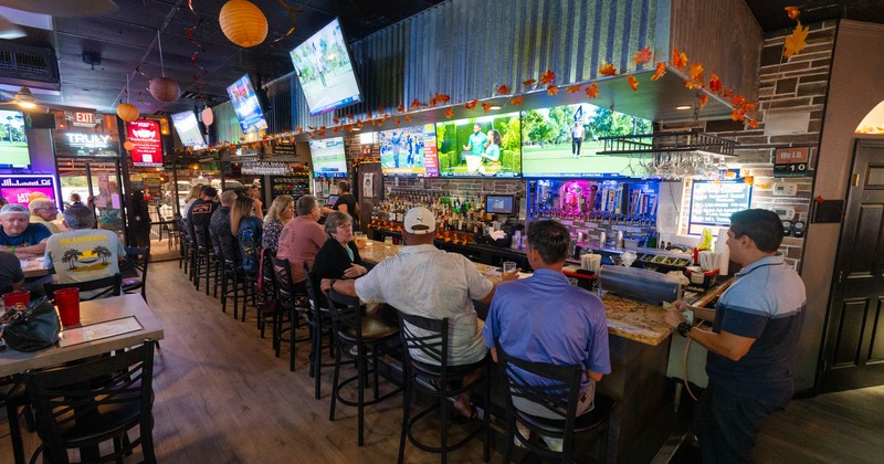 Customers sitting at the bar