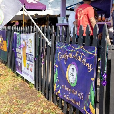 Outside, signage on a fence.