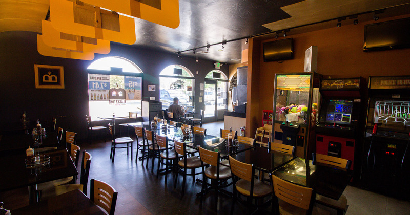 Interior,dining area with arcade machines by a wall