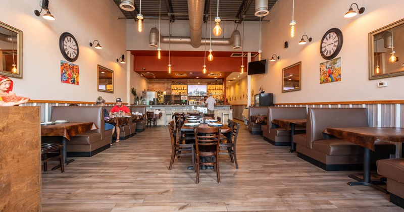 Interior, seating area with few guests in the back