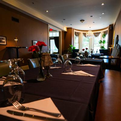 Interior, dining table set and ready to receive guests.