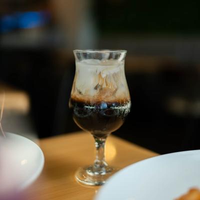 Drink in a stemmed glass served on the table.