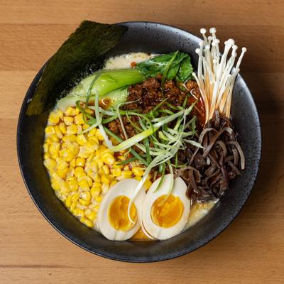 Miso Ramen with boiled egg, corn, seaweed and green onions.