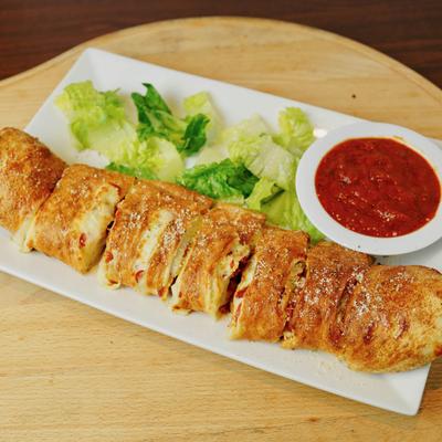 Pepperoni rolls served with lettuce and marinara.