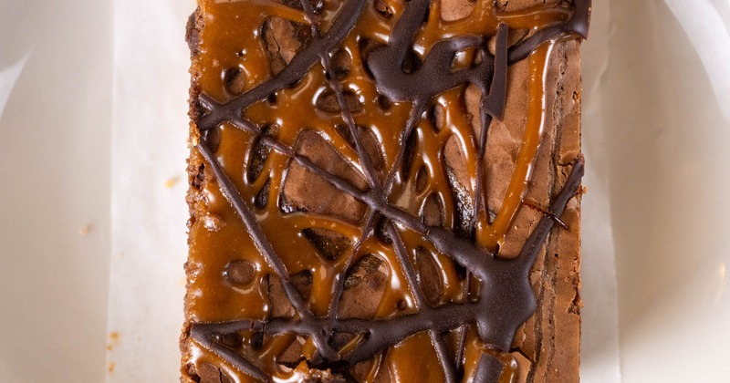 Chocolate caramel brownie on a white plate
