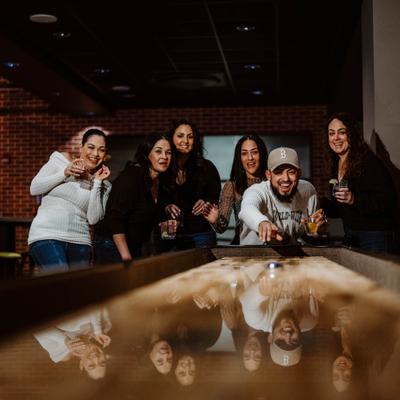 Group playing shuffleboard..