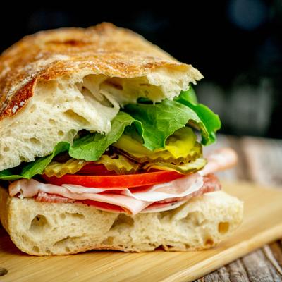 The Bucciarelli sandwich, served on a wooden board.