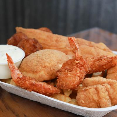 Fried shrimp, scallops, deviled crab, fries, hushpuppies, and tartar sauce.