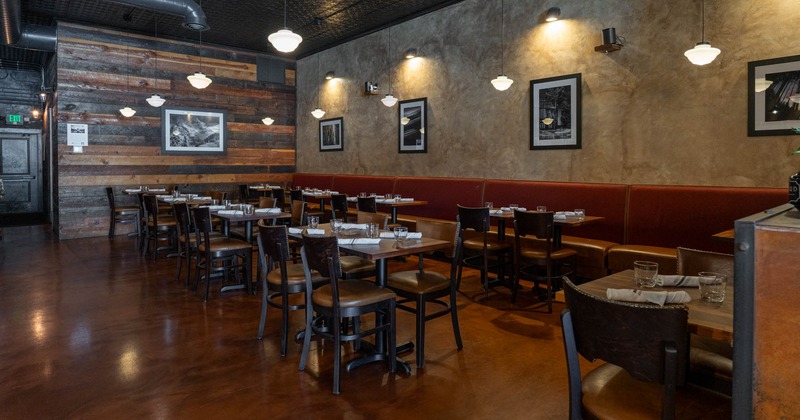 Interior, dining area, chairs and tables, framed photos on the walls