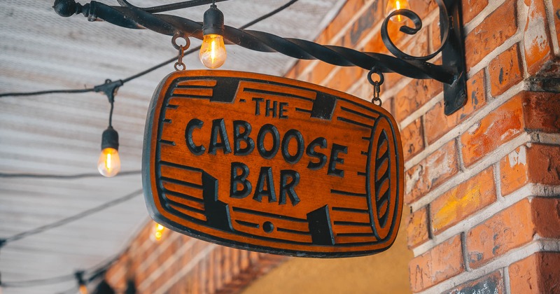 The Caboose bar hanging sign