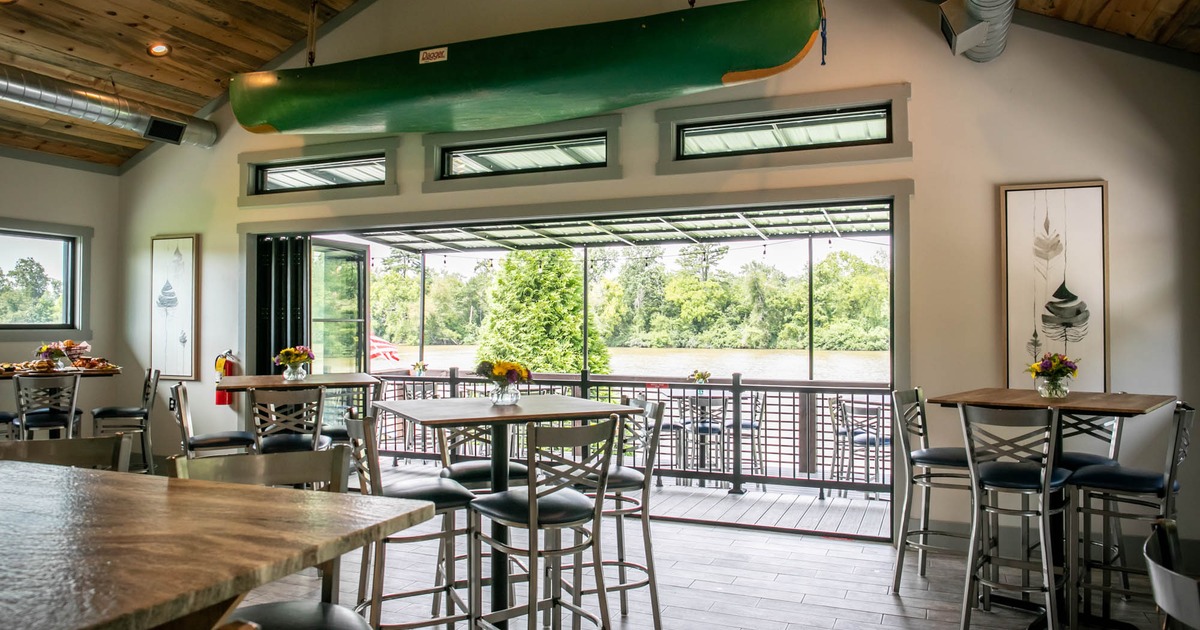 Interior, seating area, large sliding balcony doors, canoe on the ceiling as a decoration