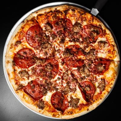 Meat Lovers Pizza with pepperoni, ham and sausage.