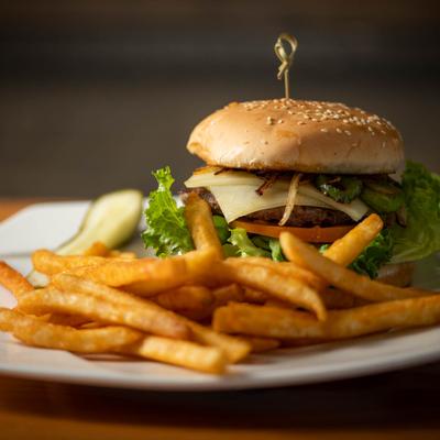 Jalapeno burger served with French fries.