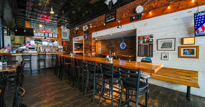 Interior, high table and chairs near bar