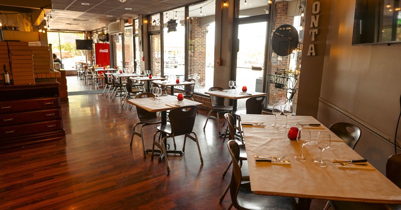 Interior, dining tables with chairs ready for guests