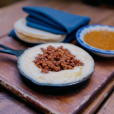 Baked Mexican cheese topped with chorizo.