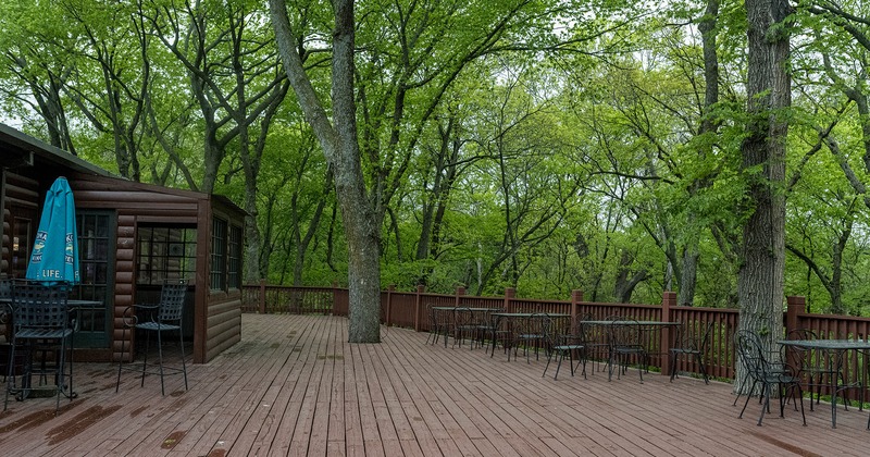 Outdoor seating area with a view of the woods