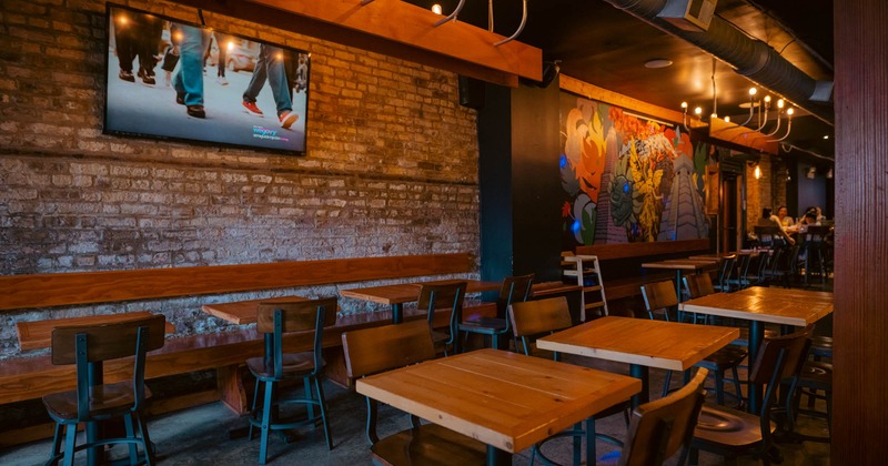 Interior, chairs and tables, TV on the wall