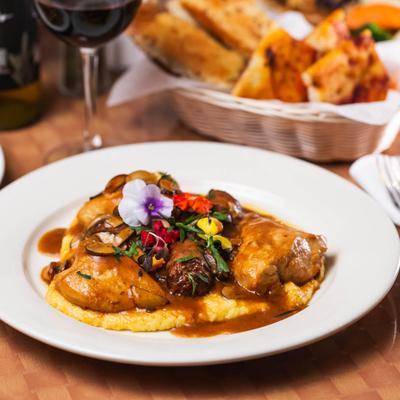 Sauteed chicken, sausage, mushrooms, garlic, rosemary, white wine sauce, and polenta.