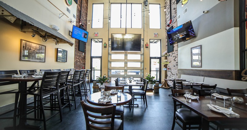 Interior with large TV screens on the walls above