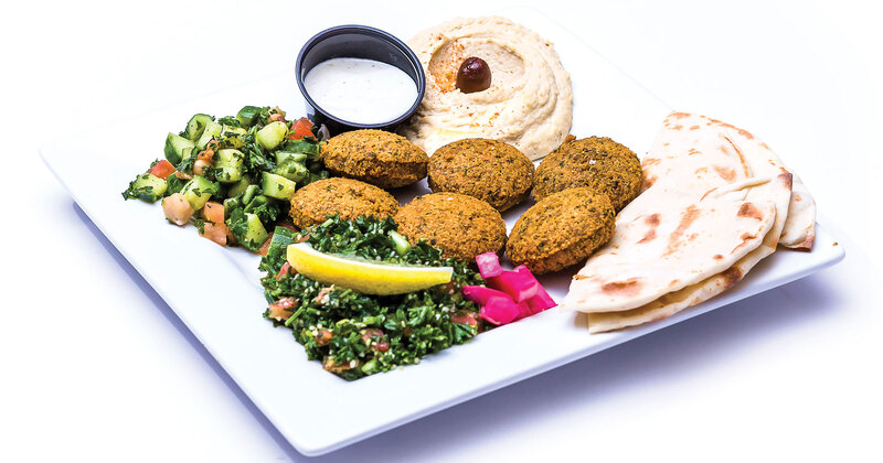 Pastry, salad, white dip on the side closeup