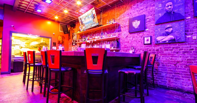 Interior, bar, room lit with neon light