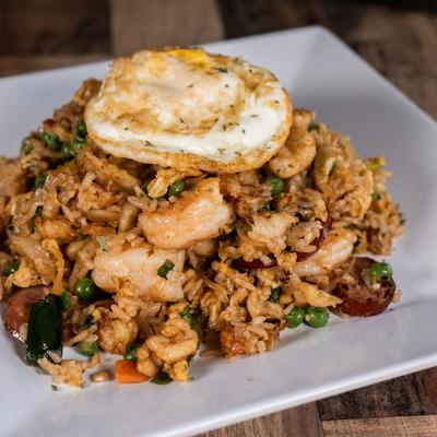 Cajun fried rice served with a fried egg on top.