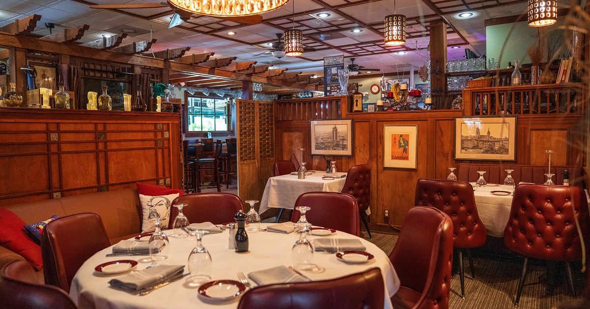 Nicely done interior dining area with set tables ready for guests