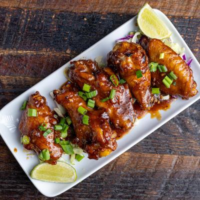 Chicken wings sauteed in medium spicy Korean sauce, served with lime wedges.