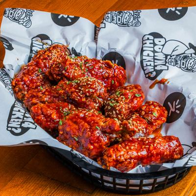 Yang Yummi Wings topped with sesame seeds and herbs.