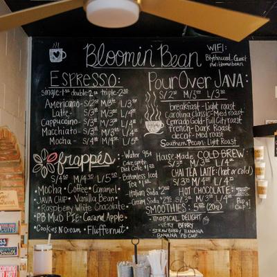 Chalkboard menu listing drink options.