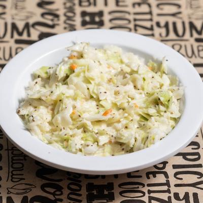 A bowl of creamy coleslaw.