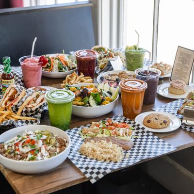 Table spread of various dishes and drinks.