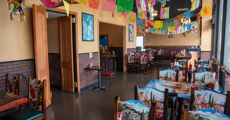 Seating area with colorful tables and chairs