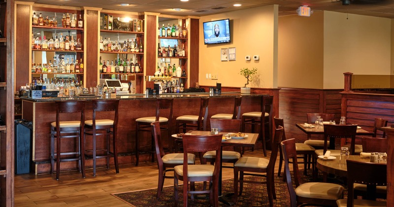 Interior, seating area with a bar in the back