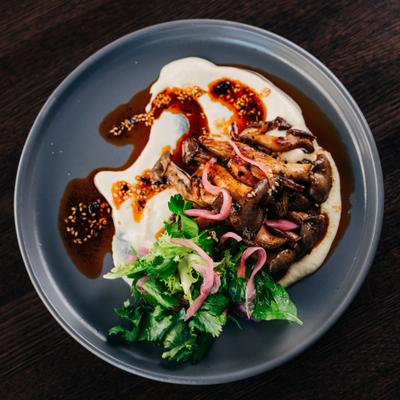 Grilled Mushrooms,  Leek + Tofu Soubise, Salsa Macha, Pickled Ramps, Cilantro, Parsley GF, Vegan.