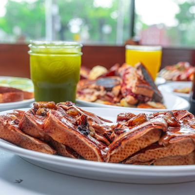 Modern Elvis French toast, served with a green juice.
