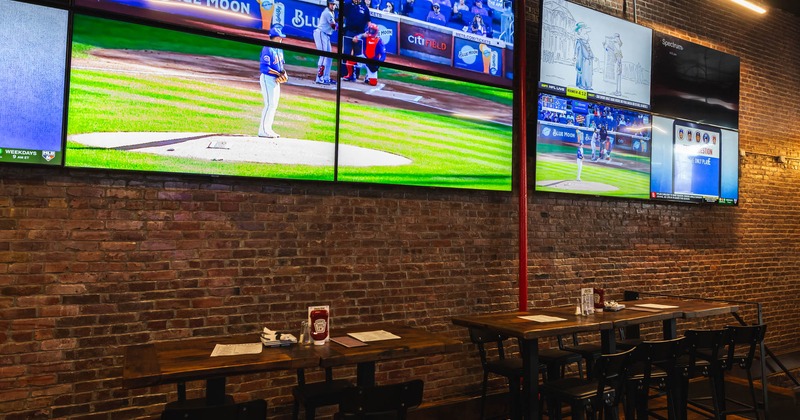 Dining area and big TVs on the wall