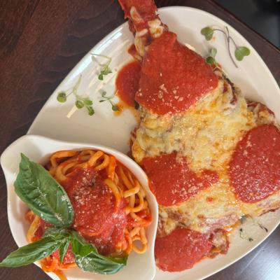 A slice of pizza and spaghetti.